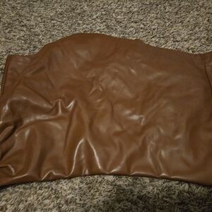 Brown leather skirt in front, shorts in back